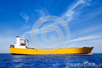 Anchor cargo yellow boat in blue sea Stock Photo