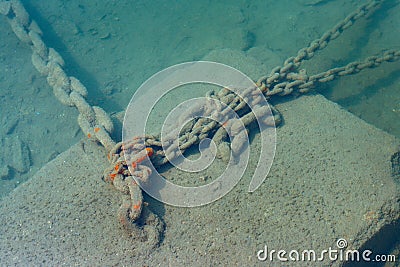 Anchor chain underwater in the sea Stock Photo