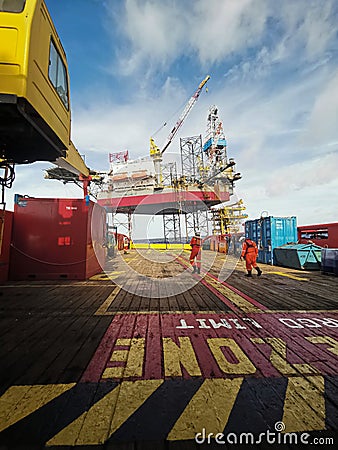 AHTS vessel stand by near oil platform Editorial Stock Photo