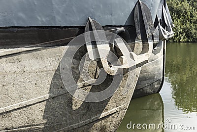 Anchor Securely Fastened to Boat Hull Stock Photo