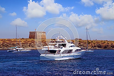 Private motor yacht approaching to anchorage in Tabarca island. Editorial Stock Photo
