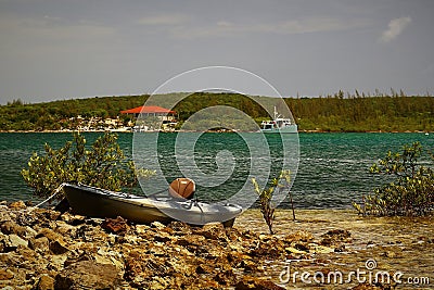 Anchored in Hatchet Bay, Eleuthera Bahamas with a kayak in the forground Stock Photo
