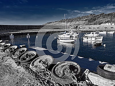 Anchors Along The Wharf At Lyme Regis With Tones Editorial Stock Photo