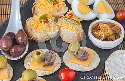 Anchovy canapes with olives and cheese close up Stock Photo