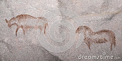 Ancient animals. drawing of an ancient man on a cave wall, executed with ocher. Stock Photo