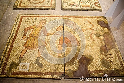 Ancient antique mosaic. Image of hunting scenes and animals. Portraits of people Editorial Stock Photo