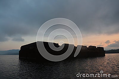 Ancient antique ruins ubosot of Wat Sri Suwan drown deep underwater of Songkalia river at sunset dawn time for thai people and Stock Photo