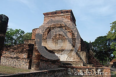 Ancient antiquity architecture and antique ruins building for thai people travelers travel visit respect praying at Si Satchanalai Stock Photo