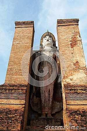 Ancient antiquity architecture and antique ruins building for thai people travelers travel visit respect praying at Si Satchanalai Stock Photo