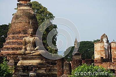 Ancient antiquity architecture and antique ruins building for thai people travelers travel visit respect praying at Si Satchanalai Stock Photo