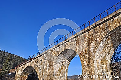 The ancient arch railway bridge from a stone Stock Photo