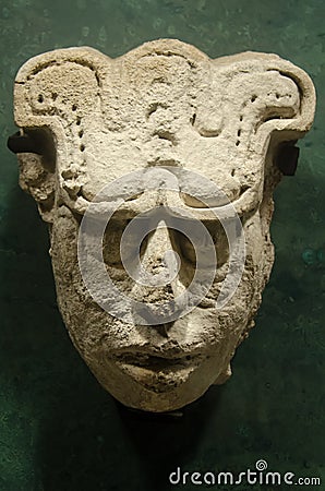 Ancient mayan head with a glyph engraved on front Stock Photo