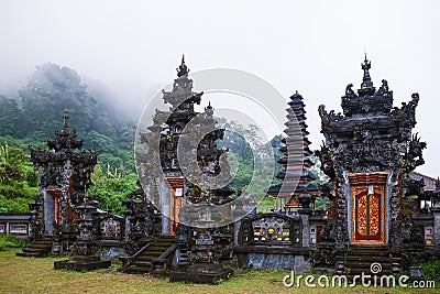 Ancient Balinese hindu temple at Buyan lake in mountain rainforest Stock Photo