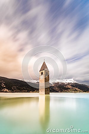 The ancient belltower of Curon emerging from the water of lake Resia Stock Photo