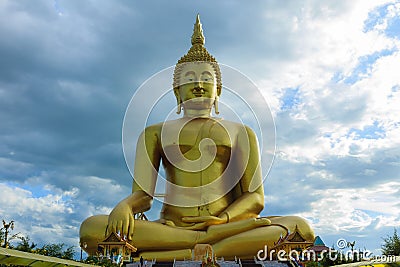 Ancient Big Buddha Image in the Field at Muang Temple , Ang Thong in Thailand Stock Photo