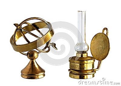 Ancient brass astrolabe and kerosene lamp Stock Photo