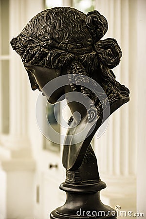 Ancient bronze woman`s head. Ariadna mythological character. Beautiful antique sculpture with nice female face Editorial Stock Photo