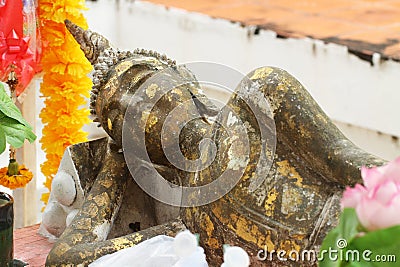 Ancient buddha statue lying sleeping gold leaf historical landmark Stock Photo