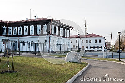 Ancient building 1822-1824 of the former county school on the embankment of the city of Yeniseisk. Editorial Stock Photo