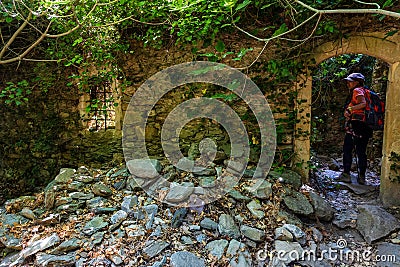 Ancient buildings in a forest being re-claimed by nature Stock Photo