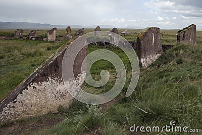 Ancient burial mounds and stones on the graves. Stock Photo