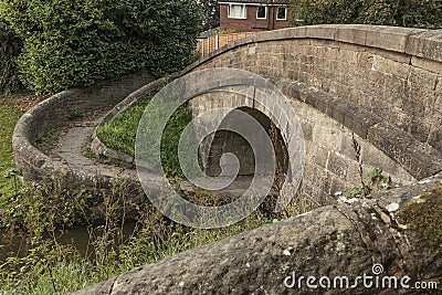 Ancient canal bridge used to move horses across to another towpath Stock Photo