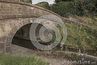 Ancient canal bridge used to move horses between tow paths Stock Photo