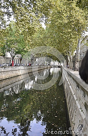 Water Canal from Quais de la Fontaine from Nimes in south of France Editorial Stock Photo