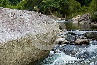 Ancient carved figures on stones in Jayuya Puerto Rico Stock Photo