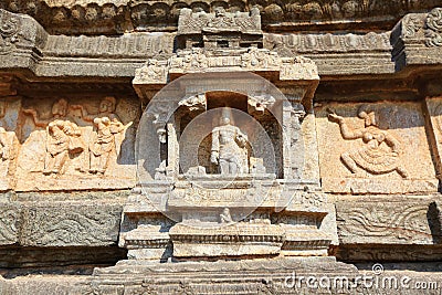 Ancient carved wall with hindu deities in Hazara Rama Jain Temple, Hampi, Karnataka Stock Photo