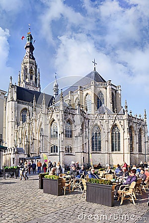 Ancient Cathedral with people on terraces, Breda, Netherlands Editorial Stock Photo