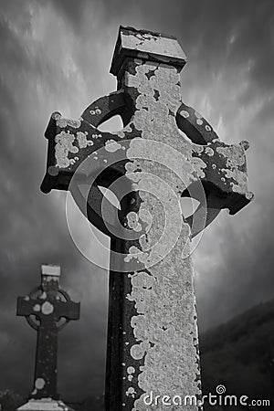 Ancient celtic cross in a cemetary in Glendalough, Ireland Stock Photo