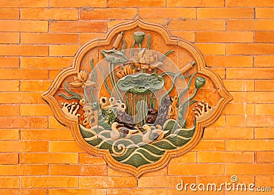 Stone relief with lotuses on the walls of the Imperial Palace, Beijing Stock Photo