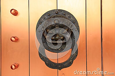 Ancient Chinese architecture copper door knocker Stock Photo