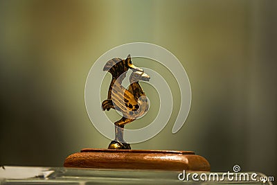 Ancient Chinese Han Dynasty artifacts in the museum, gilded rooster statue Editorial Stock Photo