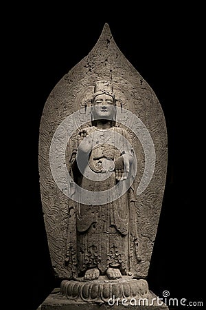 Ancient chinese standing Bodhisattva buddha limestone statue image in Northern Qi dynasty, dated 552, China Stock Photo