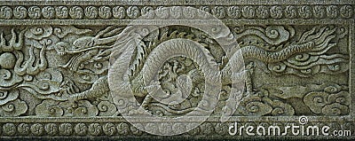 Ancient chinese stone dragon relief .marble sculpture. Editorial Stock Photo