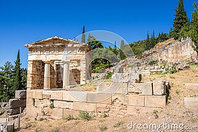 Ancient city of Delphi with ruins of the temple of Apollo. Editorial Stock Photo