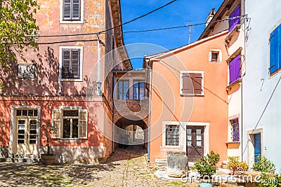 Ancient colorful houses on a stone street in Groznjan village. Stock Photo