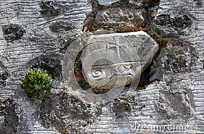 Ancient cross on the wall of ruined Greek Orthodox Church Stock Photo