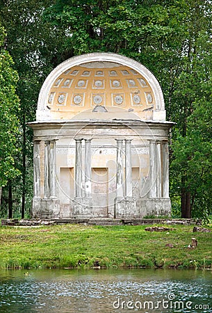 The ancient destroyed arbor in autumn park- The Eagle pavilion. Russia. Saint-Petersburg. Stock Photo