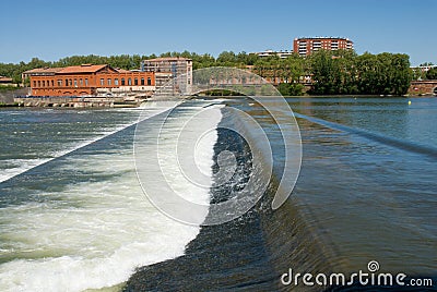 The ancient diverting dam on the Garonne river. Stock Photo