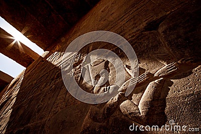 Ancient Egyptian hyeroglyphs in sunset light at Aswan Temple Philae in Egypt Stock Photo