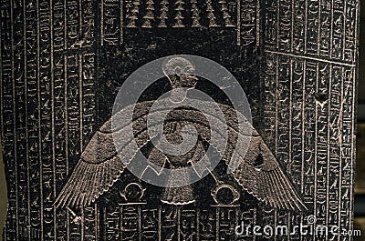 Ancient Egyptian writing, alien-like figure Stock Photo