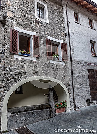 Ancient fountain in the medieval village of Bard in Valle D`Aost Stock Photo