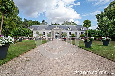 Ancient French Medieval building inside the garden of Cheverny Castle, named Orangerie du ChÃ¢teau de Cheverny Stock Photo