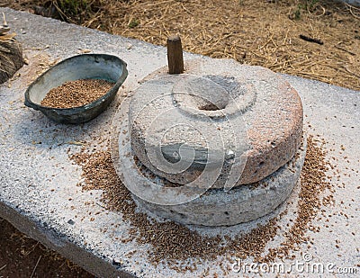 Ancient grain grinding millstones Stock Photo