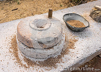 Ancient grain hand grinding millstones Stock Photo