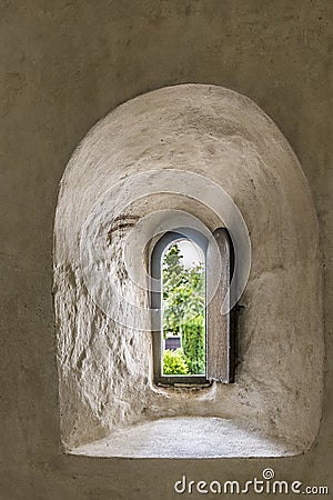 An ancient hatch through the church wall where lepers received communion Editorial Stock Photo