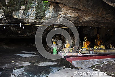 Ancient holy buddha statue in antique mystery cave for thai people travel visit respect praying blessing luck wish of Wat Khao Editorial Stock Photo